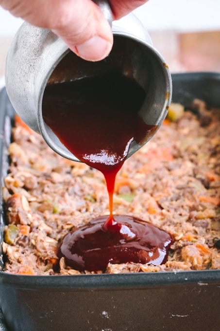 Picture of Maple Balsamic Glaze Being Poured over Vegan Lentil Loaf