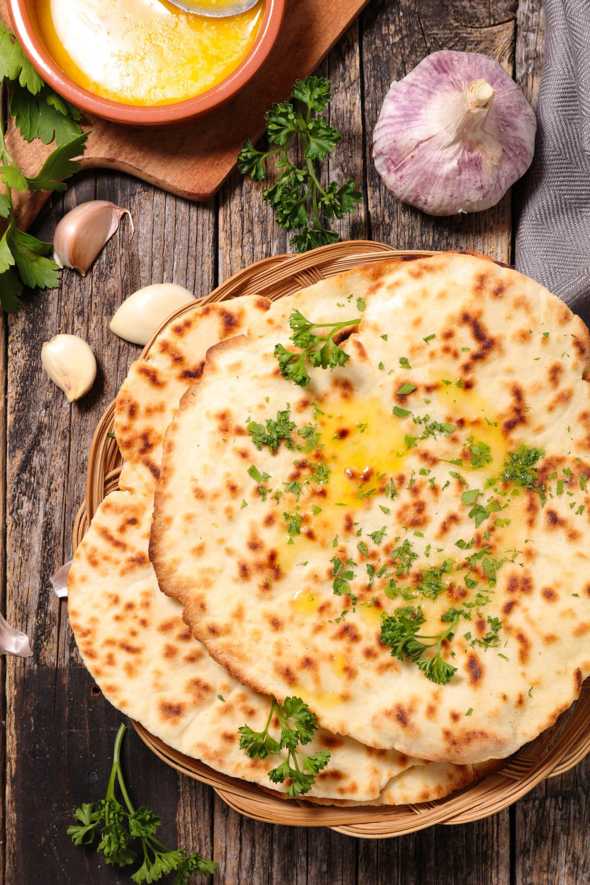 vegan naan with garlic on a wooden table