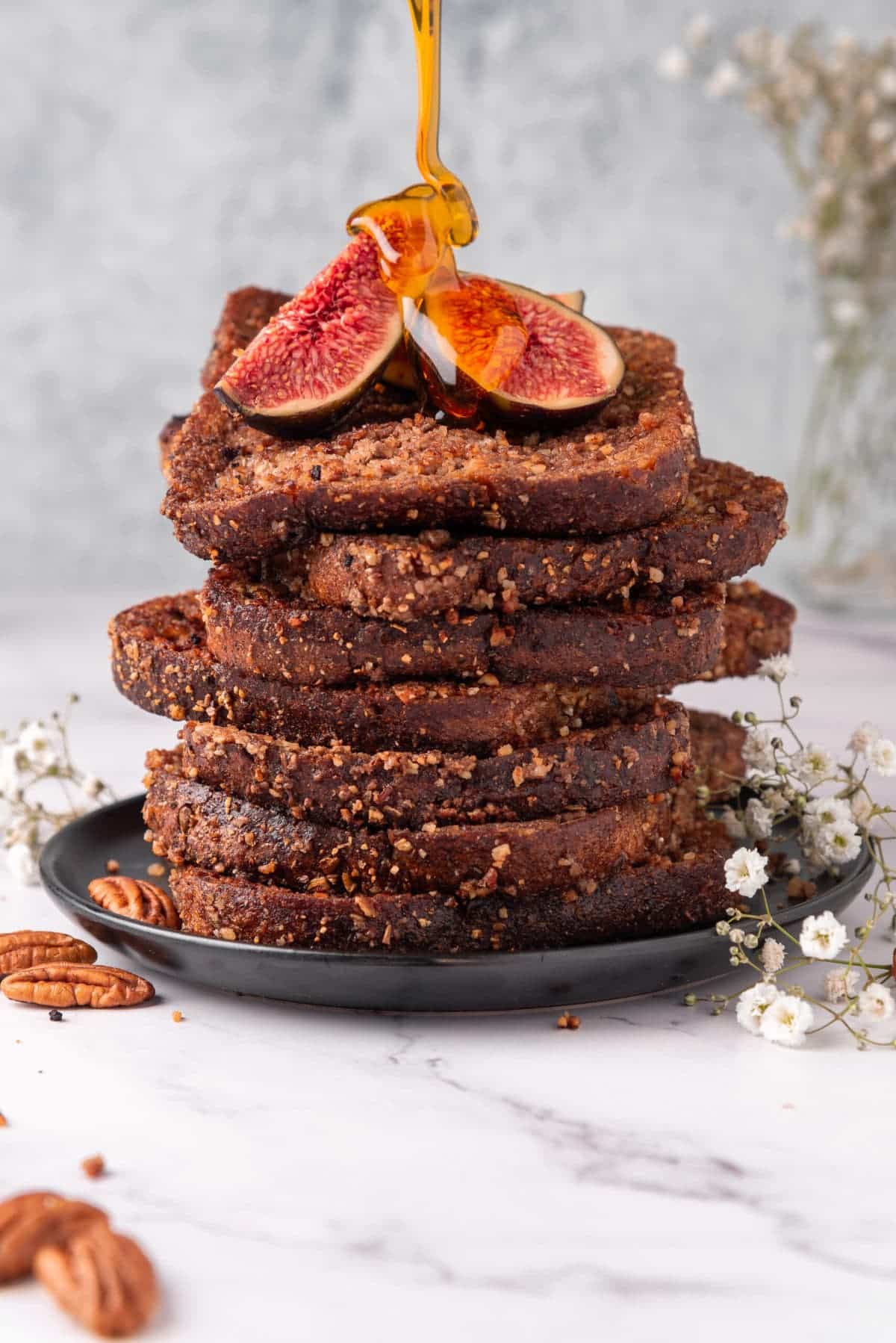 a stack of vegan french toast on a marble table