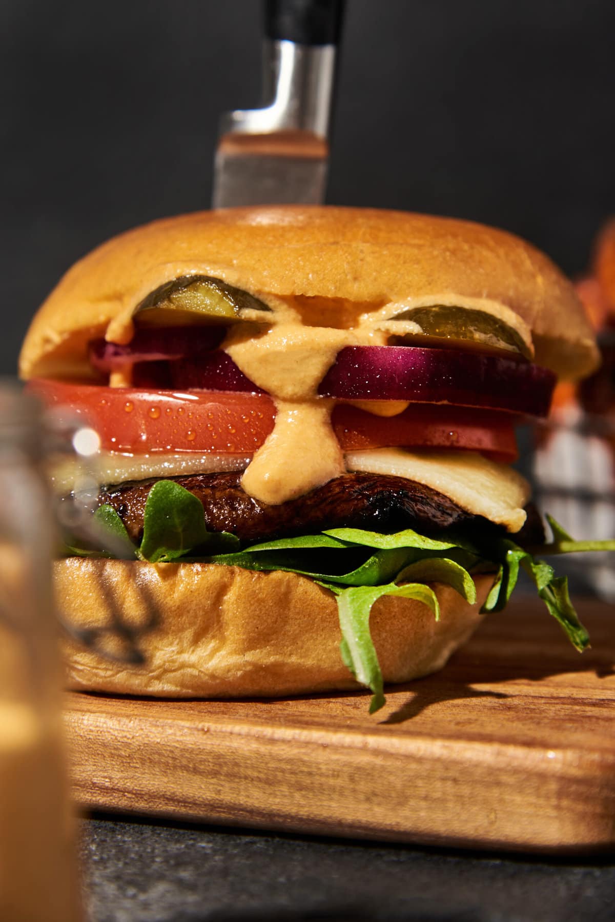 close-up of mushroom burger on a wood cutting board