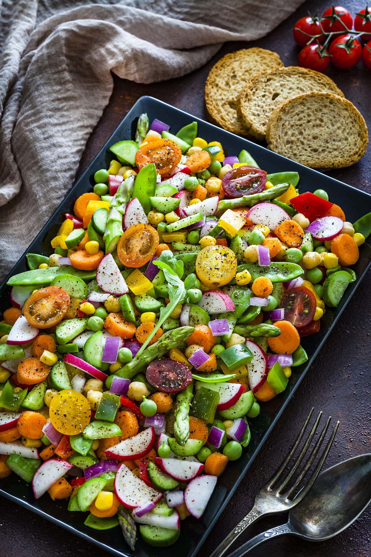 chopped vegetable salad recipe on a sheet pan 