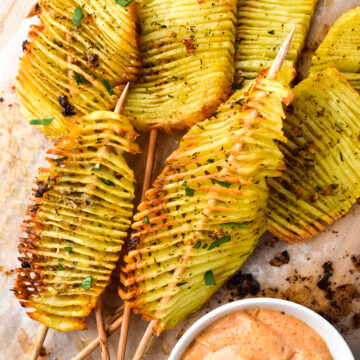 overhead view of crispy accordian potatoes with garlic chipotle dressing