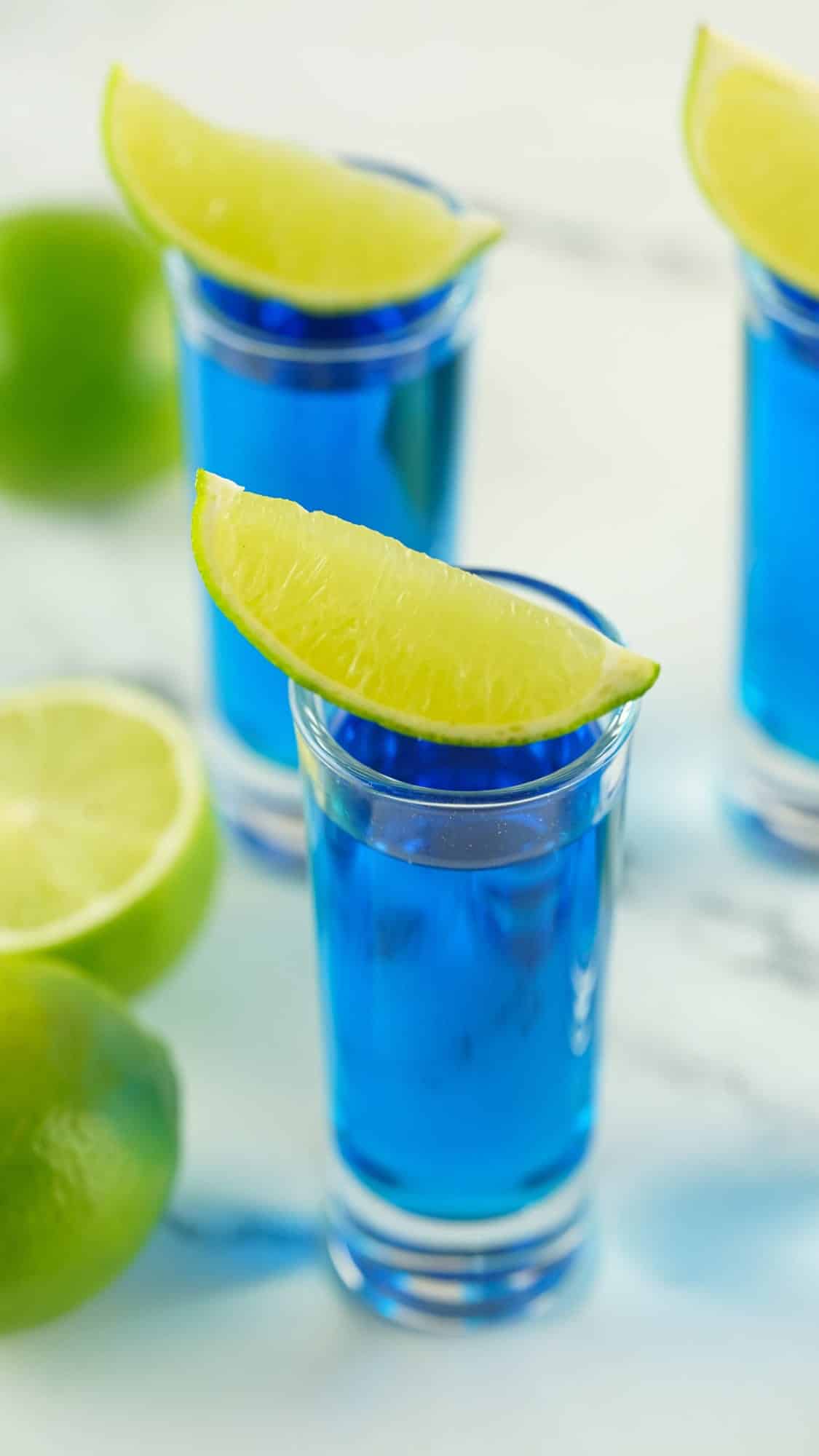 overhead view of kamikaze shots with lime wedges