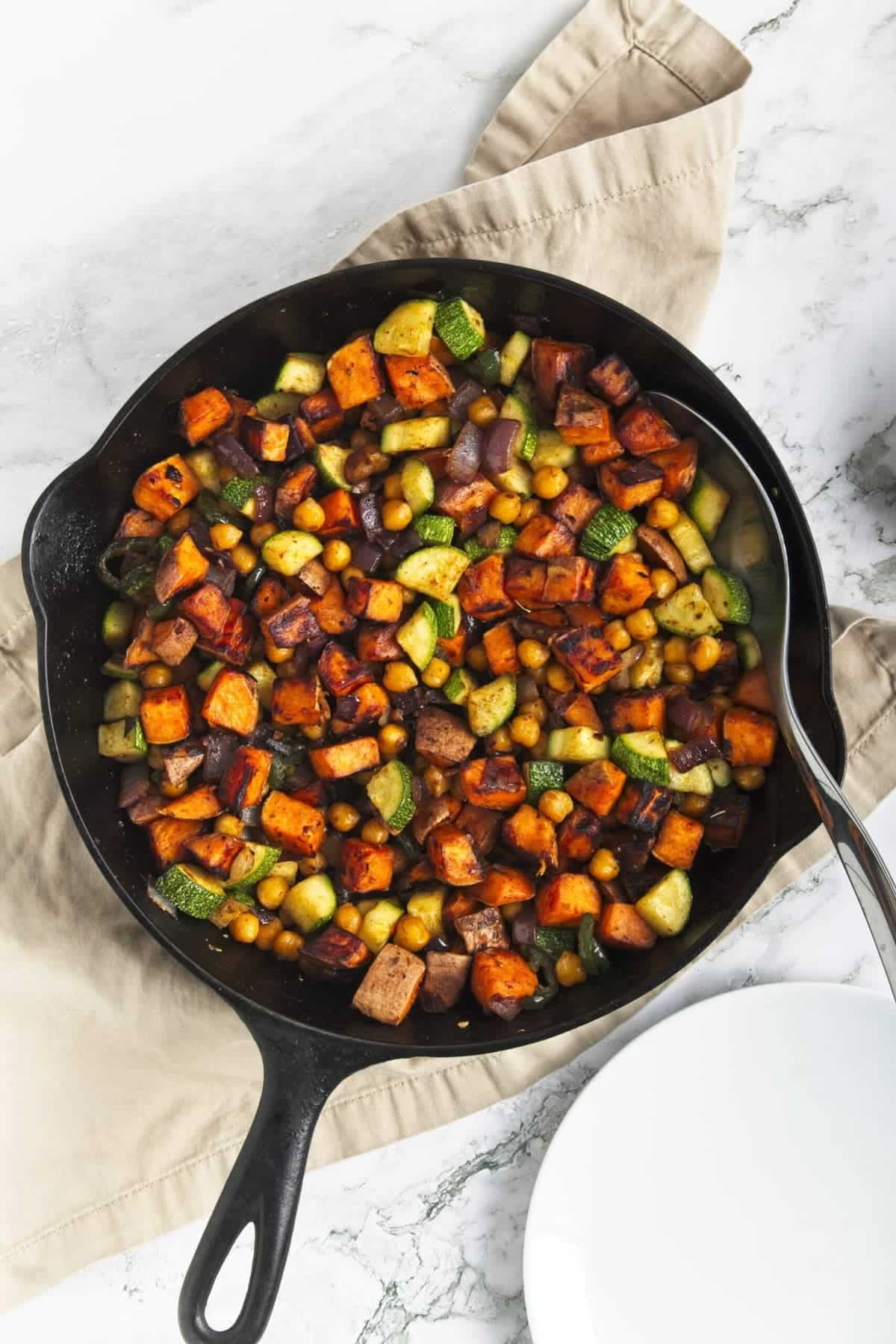 overhead view of sweet potato hash in a cast iron skillet