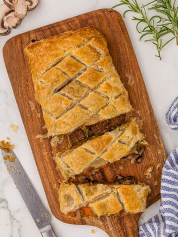 overhead view of vegan mushroom wellington on a cutting board