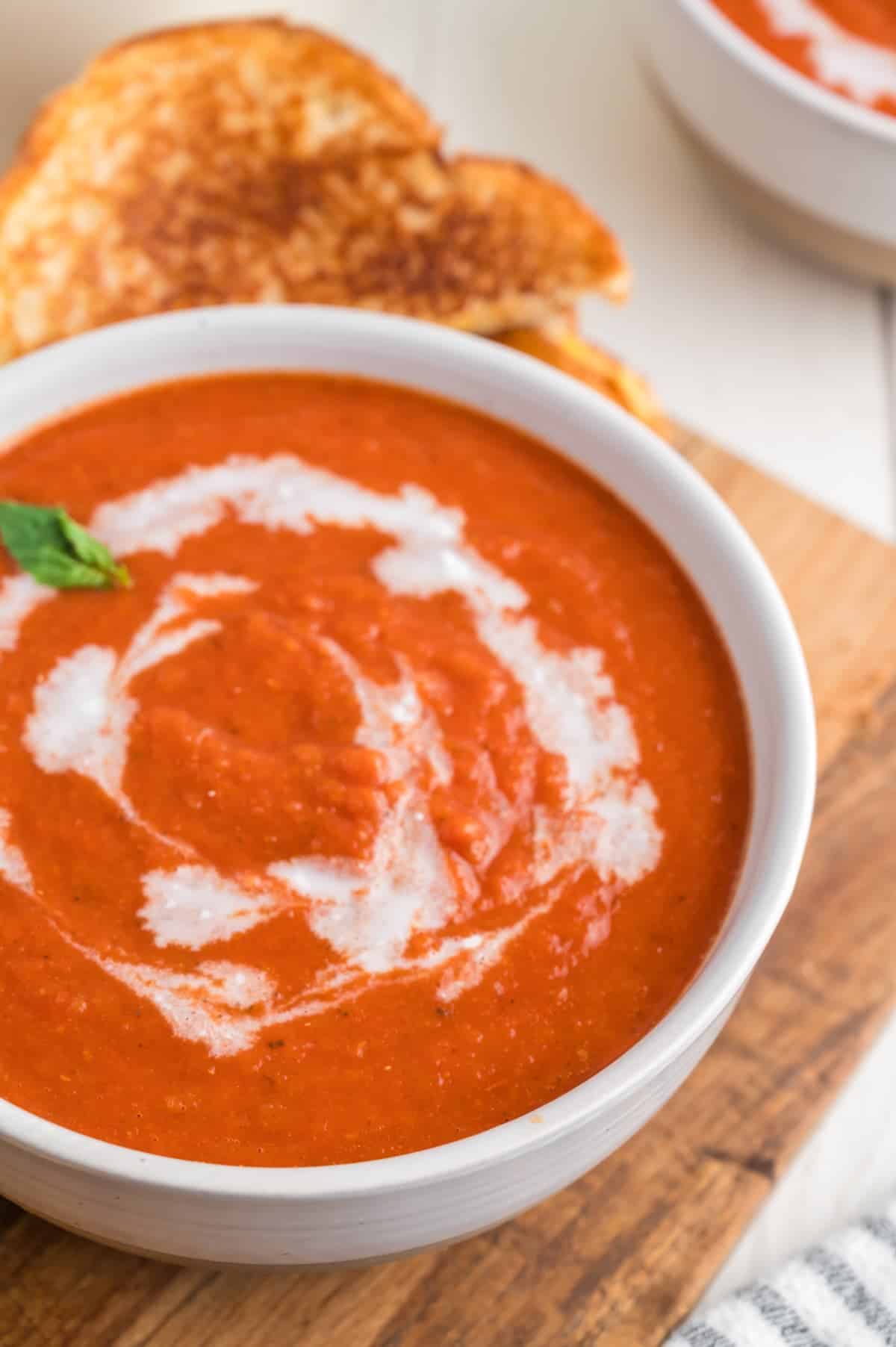 closeup of vegan tomato soup in a white bowl