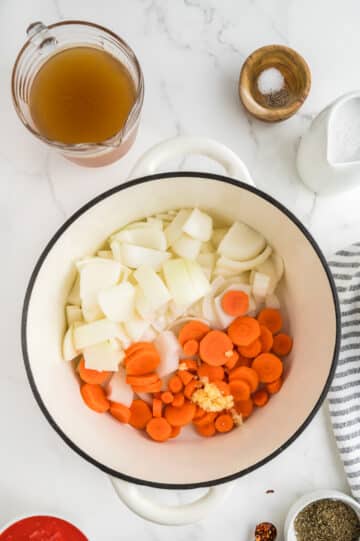 onions, garlic and carrots added to pot with olive oil