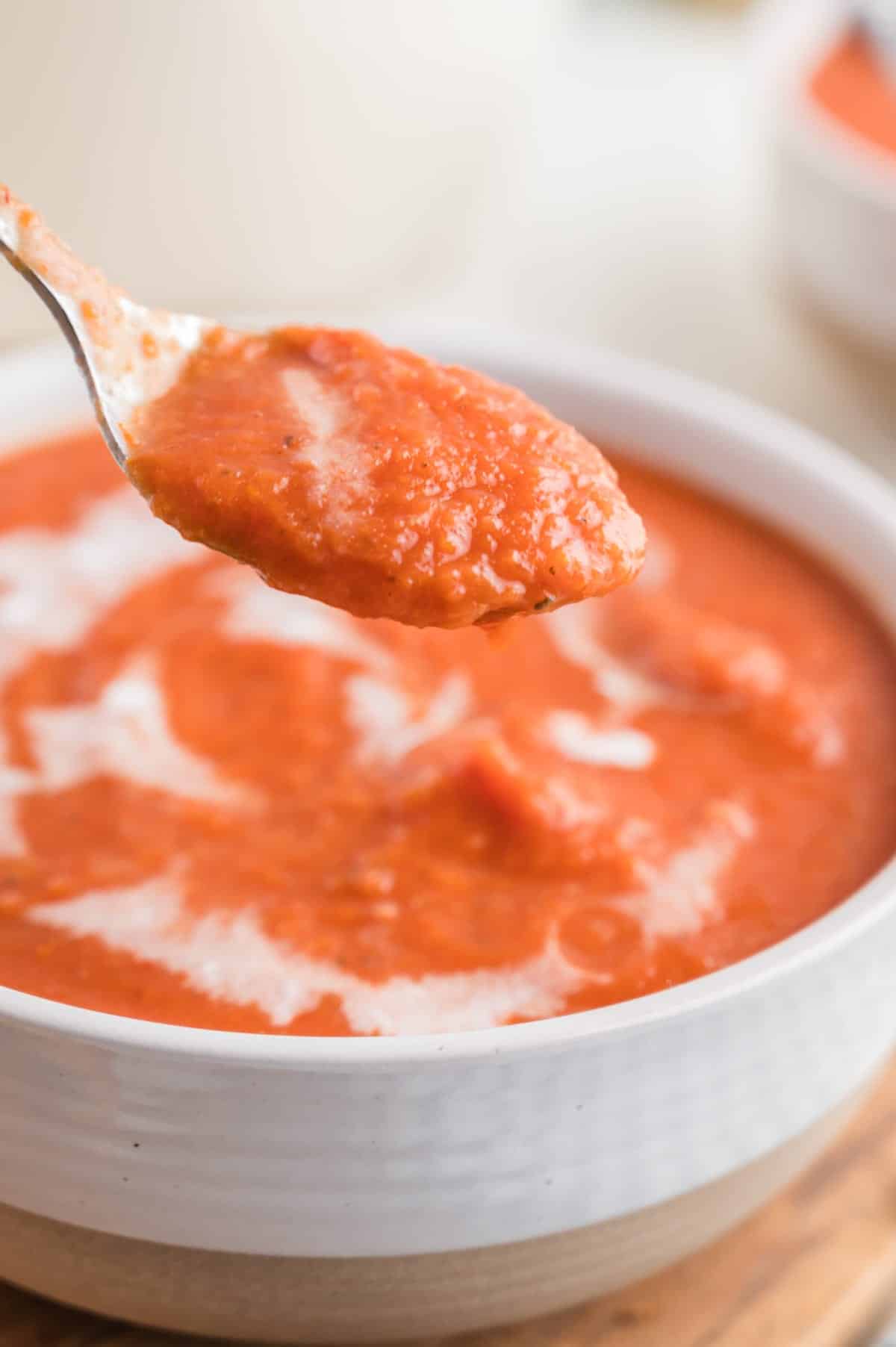 closeup of a spoonful of vegan tomato soup