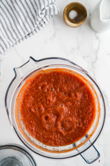 ingredients mixed in a food processor for vegan tomato soup