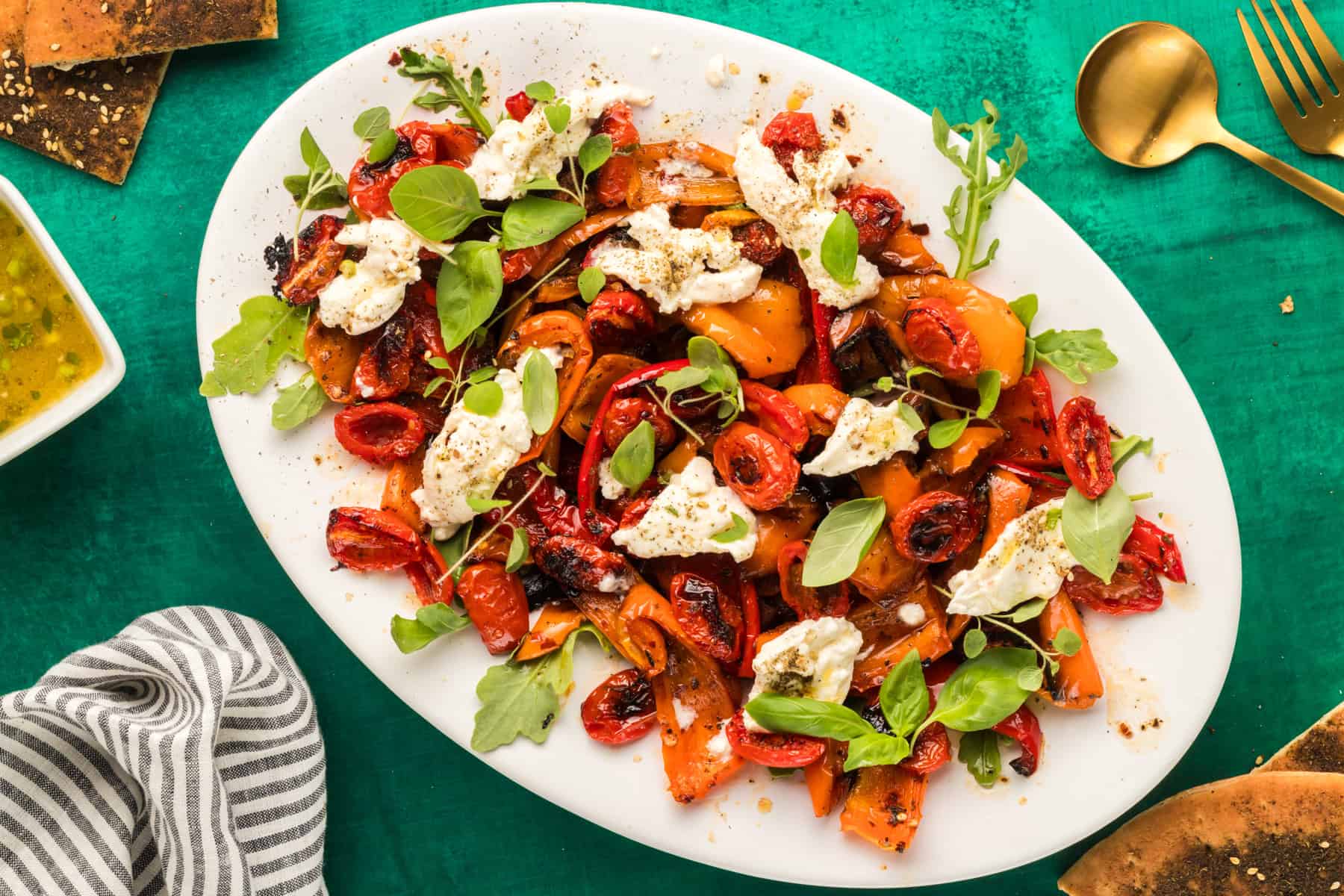 roasted bell pepper salad on a white platter